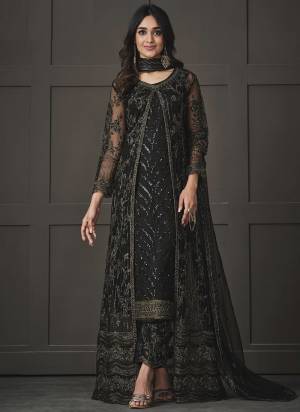 Step out in style adorning this black colored pakistani straight suit. This butterfly net suit is beautifully adorned with heavy embroidered,floral lace,cording & glitter sequences work comes along with net & japan silk bottom, inner is japan satin and net dupatta makes it appear more adorning. Women can buy this suit to wear for their upcoming festivals, homely functions, parties, kitties, weekend get together. Get this unstitched suit stitched according to your fit and comfort.