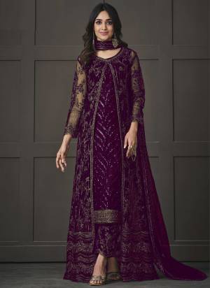 Step out in style adorning this purple colored pakistani straight suit. This butterfly net suit is beautifully adorned with heavy embroidered,floral lace,cording & glitter sequences work comes along with net & japan silk bottom, inner is japan satin and net dupatta makes it appear more adorning. Women can buy this suit to wear for their upcoming festivals, homely functions, parties, kitties, weekend get together. Get this unstitched suit stitched according to your fit and comfort.