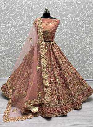 For A Fancy Designer Look,Grab These Lehenga Choli With Dupatta in Fine Colored.These Lehenga And Choli Are Bridal Net And Dupatta Are Fabricated On Soft Net Pair.Its Beautified With Designer Fancy Multy Thread,Sequance,Dori Embroidery,Diamond Work.