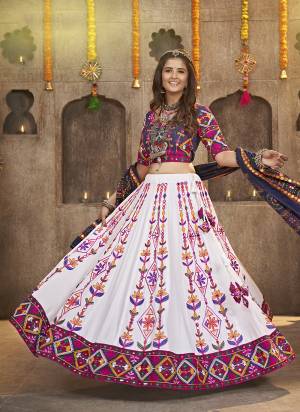 Grab These Navratri Special Lehenga Choli in Fine Colored.These Lehenga And Blouse Are Viscose Rayon And Dupatta Are Fabricated On Cotton.Its Beautified With Printed,Heavy Mirror,Thread Embroidery Work.