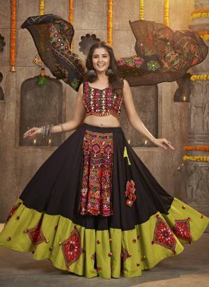 Grab These Navratri Special Lehenga Choli in Fine Colored.These Lehenga And Blouse Are Viscose Rayon And Dupatta Are Fabricated On Cotton.Its Beautified With Printed,Heavy Mirror,Thread Embroidery Work.