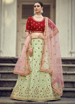 Garb This Partywear Fine Color Heavy Designer Lehemga Choli Fabric Are Malai Satin And And Dupatta Soft Net In Fabricated Beautified With Attrective Embroidery,Diamond Stone Work. Buy Now.