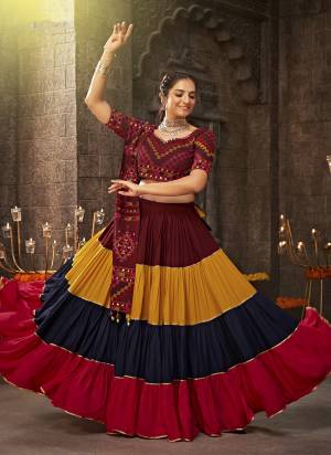 Attrective These Navratri Special Lehenga Choli in Fine Colored.These Lehenga Are Viscose Rayon And Blouse Are Viscoce Rayon And Dupatta Are Fabricated On Viscose Rayon.Its Beautified With Heavy Mirror,Thread Embroidery Work.