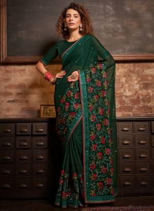 Garb These Designer Saree in Fine Colored.These Saree Are Gold Coin Chiffon And Blouse is Fabricated On Gold Coin Chiffon Pair.Its Beautified Blooming Color,Panel Embroidery,Swarovski Work.