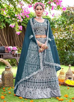 Grab These Beautiful Colored Lehenga Choli.These Lehenga and Dupatta Are Fabricated On Net Pair With Net Blouse.Its Beautified With Heavy Embroidery Work.