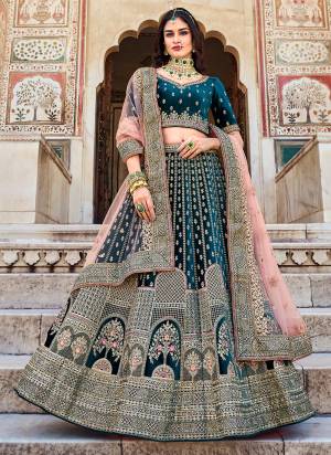 Grab These Bridal Look Lahenga Choli in Fine Colored.These Blouse And Lahenga Are Fabricated On Velvet Pair With Net Dupatta.Its Beautified With Heavy Designer Dori,Coding Embroidery,Zarkan Stone Work.