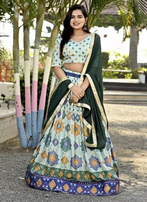 For A Designer Look,Grab These Lehenga Choli in Fine Colored.These Lehenga And Blouse Are Fabricated On Chinon Pair With Faux Georgette Dupatta.Its Beautified With Designer Printed,Sequance Embroidery Work.