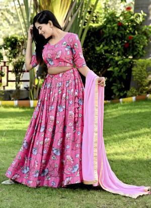 For A Designer Look,Grab These Lehenga Choli in Fine Colored.These Lehenga And Blouse Are Fabricated On Chinon Pair With Faux Georgette Dupatta.Its Beautified With Designer Printed,Sequance Embroidery Work.