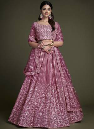 For A Designer Look,Grab These Lehenga Choli in Fine Colored.These Lehenga And Choli Are Fabricated On Georgette Pair With Soft Net Dupatta.Its Beautified With Heavy Designer Sequance,Thread Embroidery Work.