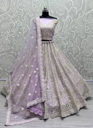 For A Fancy Designer Look,Grab These Lehenga Choli With Dupatta in Fine Colored.These Lehenga And Choli Are Net And Dupatta Are Fabricated On Soft Net Pair.Its Beautified With Dori,Jari,Sequance Embroidery,Diamond Work.