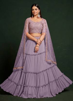 For A Designer Look,Grab These Lehenga Choli in Fine Colored.These Lehenga Are Faux Georgette And Dupatta Are Fabricated On Net Pair With Faux Georgette Blouse.Its Beautified With Thread,Sequance Embroidery Work.