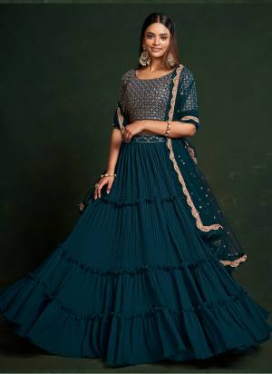 For A Designer Look,Grab These Lehenga Choli in Fine Colored.These Lehenga Are Faux Georgette And Dupatta Are Fabricated On Net Pair With Faux Georgette Blouse.Its Beautified With Thread,Sequance Embroidery Work.