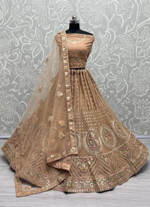 For A Fancy Designer Look,Grab These Lehenga Choli With Dupatta in Fine Colored.These Lehenga And Choli Are Net And Dupatta Are Fabricated On Soft Silk Pair.Its Beautified With Designer Thread,Sequance,Dori Embroidery,Zarkan Diamond Work.