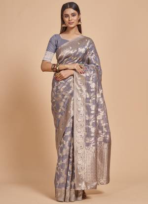 Garb This Partywear Saree Paired With Blouse In Fine Color.This Saree And Blouse Are Organza Based Fabric With Weaving Jacquard Designer. Buy This Pretty Saree Now.