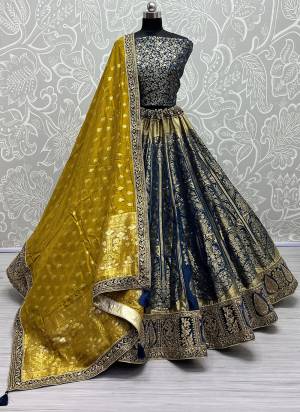 For A Fancy Designer Look,Grab These Lehenga Choli With Dupatta in Fine Colored.These Lehenga And Choli Are Banarasi Silk And Dupatta Are Fabricated On Banarasi Silk Pair.Its Beautified With Heavy Wevon Designer With Meenakari Hand Diamond Work.