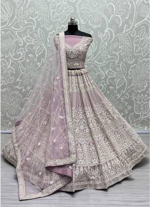 For A Fancy Designer Look,Grab These Lehenga Choli With Dupatta in Fine Colored.These Lehenga And Choli Are Net And Dupatta Are Fabricated On Soft Net Pair.Its Beautified With Designer Multy Thread,Dori Embroidery With Diamond Work.