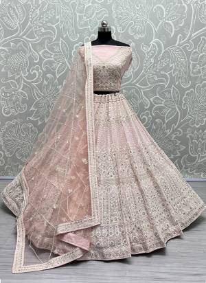 For A Fancy Designer Look,Grab These Lehenga Choli With Dupatta in Fine Colored.These Lehenga And Choli Are Net And Dupatta Are Fabricated On Soft Net Pair.Its Beautified With Designer Multy Thread,Dori Embroidery With Diamond Work.