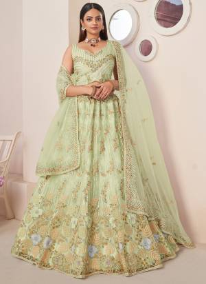 For A Fancy Designer Look,Grab These Lehenga Choli With Dupatta in Fine Colored.These Lehenga And Choli Are Net And Dupatta Are Fabricated On Net Pair.Its Beautified With Designer Sequance Embroidery,Diamond Work.