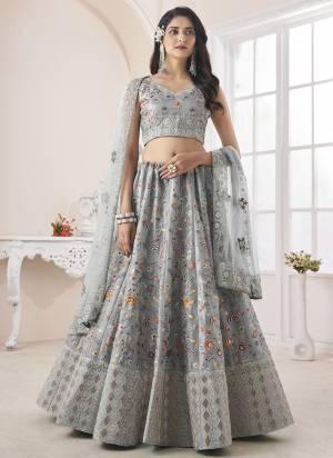 For A Fancy Designer Look,Grab These Lehenga Choli With Dupatta in Fine Colored.These Lehenga And Choli Are Art Silk And Dupatta Are Fabricated On Soft Net Pair.Its Beautified With Designer Thread,Dori Embroidery,Zarkan Work.