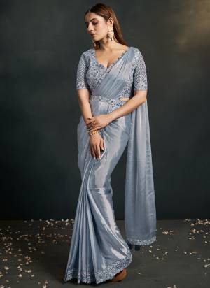 Look Attrective These Designer Party Wear Saree in Fine Light Colored.These Saree Are Satin Silk Crepe And Blouse Organza Silk is Fabricated.Its Beautified Solid With Cord Sequance,Thread Embroidery,Additional Work.