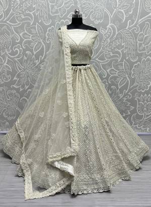 For A Fancy Designer Look,Grab These Lehenga Choli With Dupatta in Fine Colored.These Lehenga And Choli Are Net And Dupatta Are Fabricated On Soft Net Pair.Its Beautified With Designer Thread,Dori Embroidery, Diamond Work.