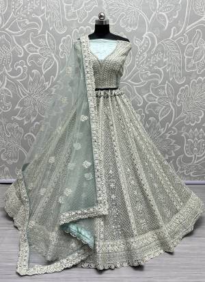 For A Fancy Designer Look,Grab These Lehenga Choli With Dupatta in Fine Colored.These Lehenga And Choli Are Net And Dupatta Are Fabricated On Soft Net Pair.Its Beautified With Designer Thread,Dori Embroidery, Diamond Work.