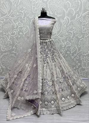 For A Fancy Designer Look,Grab These Lehenga Choli With Dupatta in Fine Colored.These Lehenga And Choli Are Net And Dupatta Are Fabricated On Soft Net Pair.Its Beautified With Designer Thread,Dori Embroidery, Diamond Work.