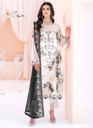 White colored pakistani suit is prettified with floral embroidered with sequins work as shown which makes it appear classy. This top is made of georgette fabric which is accompanied with santoon bottom, santoon lining and Nazmin Chiffon dupatta. Women can buy this suit to wear for their parties and functions.