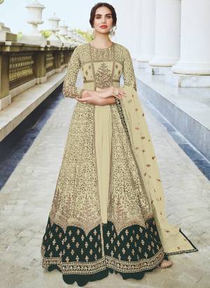 This Cream colored anarkali suit is beautifully Embroidery Work, Diamond Work and sequins work as shown. This net anarkali suit comes along with semi stitched Santoon bottom, Santoon Inner and net dupatta which makes it appear more adorning. Women can buy this suit to wear for their party, sangeet, homely events and ideal for any fashionista.