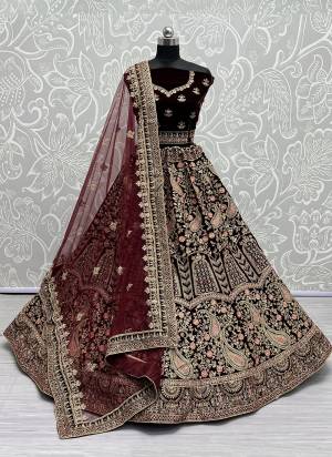 For A Fancy Designer Look,Grab These Lehenga Choli With Dupatta in Fine Colored.These Lehenga And Choli Are Velvet And Dupatta Are Fabricated On Soft Net Pair.Its Beautified With Designer Thread,Dori Embroidery, Diamond Work.