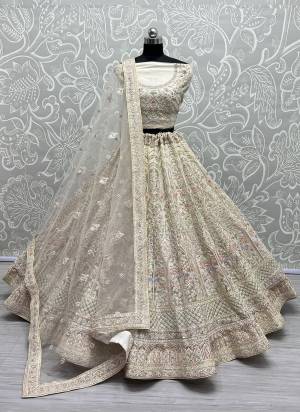 For A Fancy Designer Look,Grab These Lehenga Choli With Dupatta in Fine Colored.These Lehenga And Choli Are Net And Dupatta Are Fabricated On Soft Net Pair.Its Beautified With Designer Sequance,Thread,Dori Embroidery, Diamond Work.