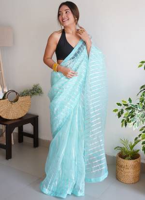 Attrective Looking These Party Wear Saree in Fine Colored.These Saree Are Organza And Blouse is Fabricated On Art Silk.Its Beautified With Designer Gota Lace Work.