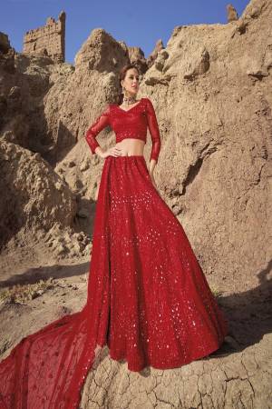 For A Designer Look,Grab These Lehenga Choli in Fine Colored.These Lehenga And Blouse Are Fabricated On Net Pair With Net Dupatta.Its Beautified With Designer Mirror Embroidery Cut Work With Zarkan Work.