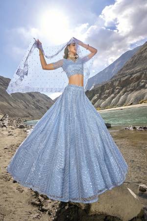 For A Designer Look,Grab These Lehenga Choli in Fine Colored.These Lehenga And Blouse Are Fabricated On Net Pair With Net Dupatta.Its Beautified With Designer Mirror Embroidery Cut Work With Zarkan Work.