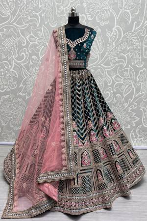 For A Fancy Designer Look,Grab These Lehenga Choli With Dupatta in Fine Colored.These Lehenga And Choli Are Velvet And Dupatta Are Fabricated On Soft Net Pair.Its Beautified With Heavy Designer Multy Thread Embroidery ,Diamond Work.