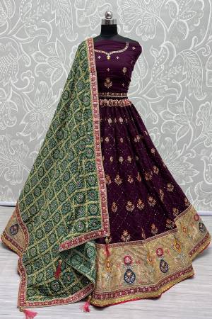 For A Fancy Designer Look,Grab These Lehenga Choli With Dupatta in Fine Colored.These Lehenga And Choli Are Gadhawal Silk And Dupatta Are Fabricated On Chiffon Pair.Its Beautified With Designer Printed,Jari Sequance Embroidery,Zarkan Diamond Work.