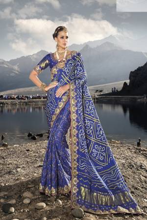 Looking These Party Wear Saree in Fine Colored.These Saree Are Gajji Satin And Blouse is Fabricated On Silk.Its Beautified Designer Real Mirror,Moti,Cut Dana,Kachhi Work With Diamond Work.