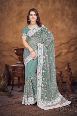 Garb This Party Wear Saree Are Fine Saree Paired With Blouse.This Saree And Blouse Are Organza Fabric With Designer Heavy Multy Thread Embroidery Work. Buy This Pretty Saree Now.