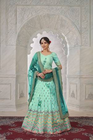 For A Fancy Designer Look,Grab These Lehenga Choli With Dupatta in Fine Colored.These Lehenga And Choli Are Shibori Crepe And Dupatta Are Fabricated On Net Pair.Its Beautified With Designer Mirror,Jari Embroidery,Stone Work.