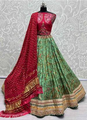 For A Fancy Designer Look,Grab These Lehenga Choli With Dupatta in Fine Colored.These Lehenga And Choli Are Silk And Dupatta Are Fabricated On Bandhani Pair.Its Beautified With Designer Printed, Embroidery Work Lace.