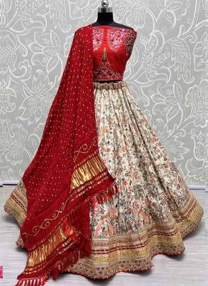 For A Fancy Designer Look,Grab These Lehenga Choli With Dupatta in Fine Colored.These Lehenga And Choli Are Silk And Dupatta Are Fabricated On Bandhani Pair.Its Beautified With Designer Printed, Embroidery Work Lace.