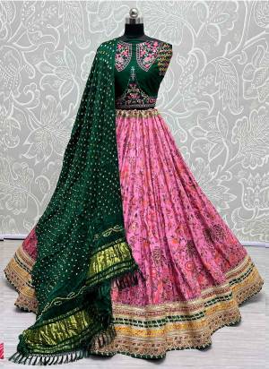 For A Fancy Designer Look,Grab These Lehenga Choli With Dupatta in Fine Colored.These Lehenga And Choli Are Silk And Dupatta Are Fabricated On Bandhani Pair.Its Beautified With Designer Printed, Embroidery Work Lace.