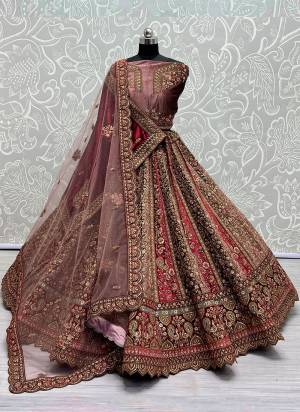 For A Fancy Designer Look,Grab These Lehenga Choli With 2 Dupatta in Fine Colored.These Lehenga And Choli Velvet And Dupatta Are Fabricated On Velvet And Soft Net.Its Beautified With Designer Thread,Sequance,Dori Embroidery Diamond Work.