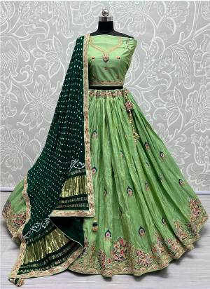 For A Fancy Designer Look,Grab These Lehenga Choli With  Dupatta in Fine Colored.These Lehenga And Choli Dolla Silk And Dupatta Are Fabricated On Gajji Silk.Its Beautified With Designer Sequance,Jari Embroidery,Zarkan Diamond Work.