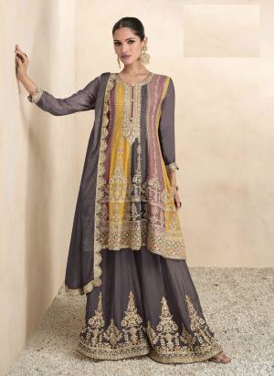 Attrective These Designer Free Size Plazzo Suit in Fine Colored Pair With Bottom And Dupatta.These Top Are Chinon And Dupatta Are Fabricated On Chinon Pair With Chinon Bottom.Its Beautified With Santoon Inner.Its Beautified With Designer Heavy Embroidery Work.