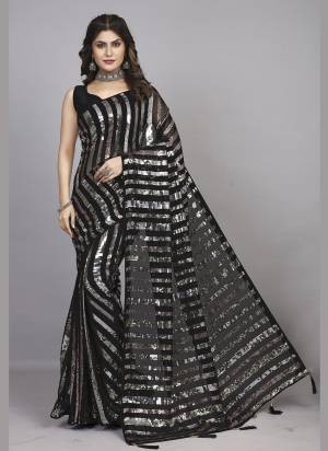 Attrective Look These Party Wear Saree in Fine Colored.These Saree Are Georgette And Blouse is Mono Banglori Fabricated.Its Beautified With Designer Heavy Sequance Embroidery Work Lace Border.