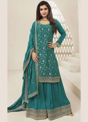 Attrective Looking These Party Wear Sharara Suit in Fine Colored Pair With Bottom And Dupatta.These Top And Dupatta Are Fabricated On Viscose Chinon Jacquard Pair With Viscose Chinon Bottom.Its Beautified With Wevon Jacquard Designer With Embroidery Work.