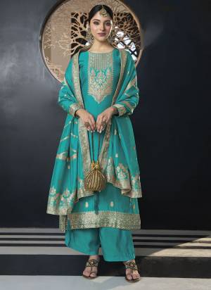 Looking These Suit in Fine Colored Pair With Bottom And Dupatta.These Top Are Viscose Silk And Dupatta Are Fabricated On Organza Pair With Silk Bottom.Its Beautified With Jacquard Wevon Designer With Gota Jari Hand Work.