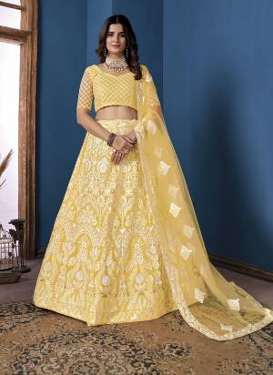 Grab These Beautiful Colored Lehenga Choli.These Lehenga and Dupatta Are Fabricated On Net Pair With Net Blouse.Its Beautified With Heavy Thread,Sequance Embroidery Work.