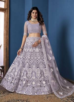 Grab These Beautiful Colored Lehenga Choli.These Lehenga and Dupatta Are Fabricated On Net Pair With Net Blouse.Its Beautified With Heavy Thread,Sequance Embroidery Work.